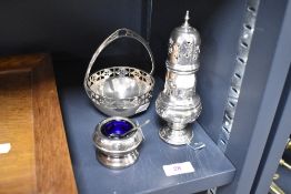 A trio of early 20th century plated ware including chase work sugar sifter, mustard pot with blue