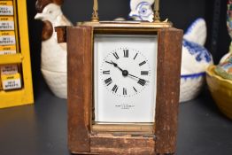 An early 20th century French made carriage clock having bevelled glass sides and gallery,enamel face