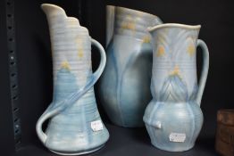 A trio of art deco Beswick vases having mottled blue and yellow ground, impressed numbers to
