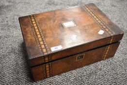 A 19th century walnut writing slope, with bands of geometric inlay, fitted interior 14cm x 35cm x