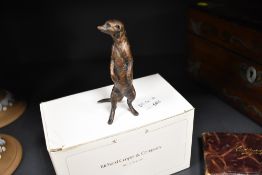 A Richard Cooper & company,art in bronze ,Meerkat standing 240, impressed number to tail of 117/