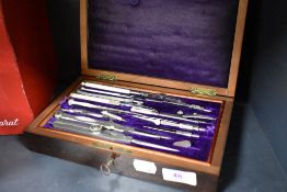 An early 20th century stained mahogany drawing set, with removable tray to the interior, appears