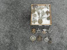 A collection of approx 20 Military Cap Badges including Westmorland & Cumberland, The Kings Royal