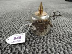 A Miniature German WWI Pickelhaube Ink Well Helmet with Sword through helmet and removable top,