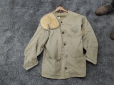 A size 48 Rifle Jacket with padded shoulder & arms, marksman badges on back