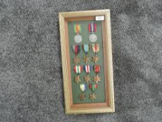 A framed and glazed display of WWII Medals, Defence and War, Stars 1939-45, Atlantic, Air Crew