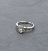 A diamond solitiare dress ring having a marquise cut diamond, approx 0.85ct in a claw set mount to