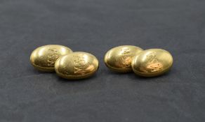A pair of 18ct gold cufflinks of oval cushion form bearing monograms with chain connectors, approx