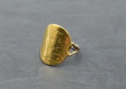 A gold sovereign ring with fixed yellow metal loop stamped 9ct, size Q and approx 8.9g, sovereign