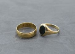 A 9ct gold wedding band and signet ring having blood stone oval panel, sizes N & O and total