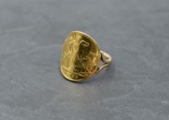 A gold half sovereign ring dated 1902 with attached yellow metal loop, bearing marks, size N and
