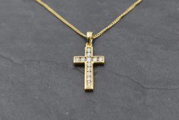 An 18ct gold cross pendant and chain set with 12 diamonds, total approx 0.4ct, 18' chain and