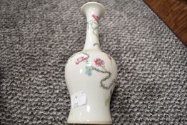 A Chinese export hard paste vase decorated with flowers and bearing reign mark to base