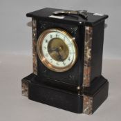 A Victorian mantle or bracket clock having slate and marble case with enamel face
