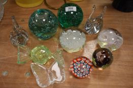 A selection of art glass paper weights and Victorian glass dumps