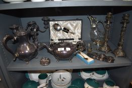 A selection of silver plated table wares including candle sticks tea pots and cutlery