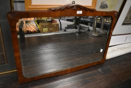 A Victorian over mantle mirror having bevel edged glass with mahogany frame