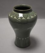 A 20th century Vietnamese celadon glazed vase decorated with storks