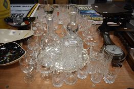 A selection of cocktail wine and spirit glasses including cut glass decanters and serving tray