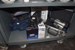 A selection of digital video and movie cameras including Handycam and Panasonic