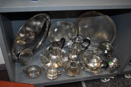 A good collection of hammered effect pewter wares including part tea set and serving trays