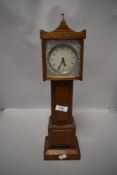 An Edwardian apprentice style miniature long case clock having a Smiths mechanism