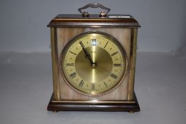 A mid century mantle clock by Metamec having brass and composite case