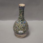 An antique Islamic slender neck vase having an Iznik style pattern