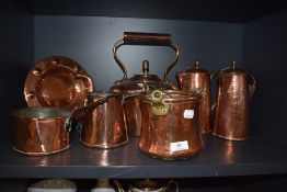 A good collection of antique and later copper kitchen wares including sauce pots water jugs and