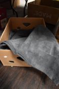 A good selection of upholstery suede leather fabric in a grey blue tone