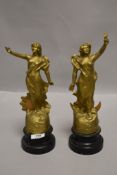 A pair of French spelter mantle garniture figures night and day