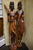 Two large standing African statue figures in carved ethnic woods