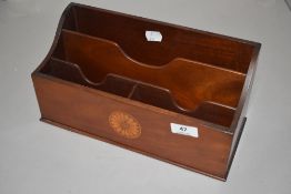 An Edwardian desktop tidy or letter rack with inlayed design