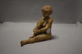 A 20th century studio pottery figure study of a nude woman seated