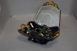 An early 20th century twin handle bowl by Carlton ware and a Barbola mirror