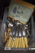 A selection of cutlery and table wares including butter knives