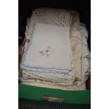 A selection of needle work and embroidery place mats and table cloths