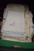 A selection of needle work and embroidery place mats and table cloths