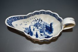 An 18th century Liverpool porcelain gravy boat, of oval form, decorated in under-glaze blue with