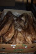 A full length mink fur coat and similar animal fur jackets