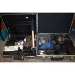 Two hard bodied case containing photographic equipment including two Minolta 9000 and zoom 75-300