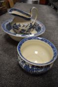 A traditional blue and white ware wash jug and bowl set by Wedgwood in the Willow design