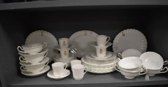 A part tea and breakfast set by Tuscan china bearing a nautical fouled anchor crest' Sigil:offi: