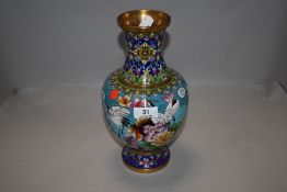 A 20th century cloisonne vase decorated with scenes of stalks and landscape
