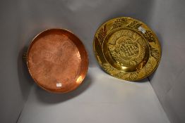 Two pieces of arts and crafts metal ware including brass hand worked dish and a footed copper