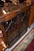 An early 20th Century oak low bookcase, width approx. 91cm