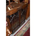 An early 20th Century oak low bookcase, width approx. 91cm