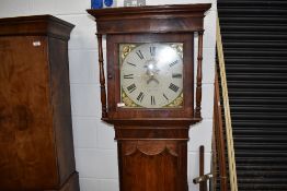 A long case clock having oak and mahogany case with painted clock face