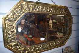 A brass framed wall mirror, From the estate of the late Cedric Robinson, Guide over the Sands