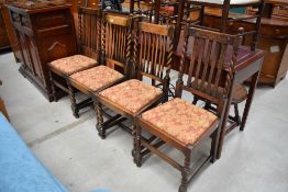 A set of two plus two carver dining chairs with oak twist frames